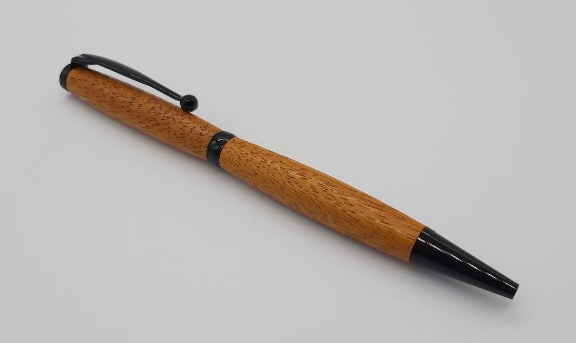 Ballpoint pen handmade in Iroko wood from Phoenix Wharf, Plymouth. DevonPens