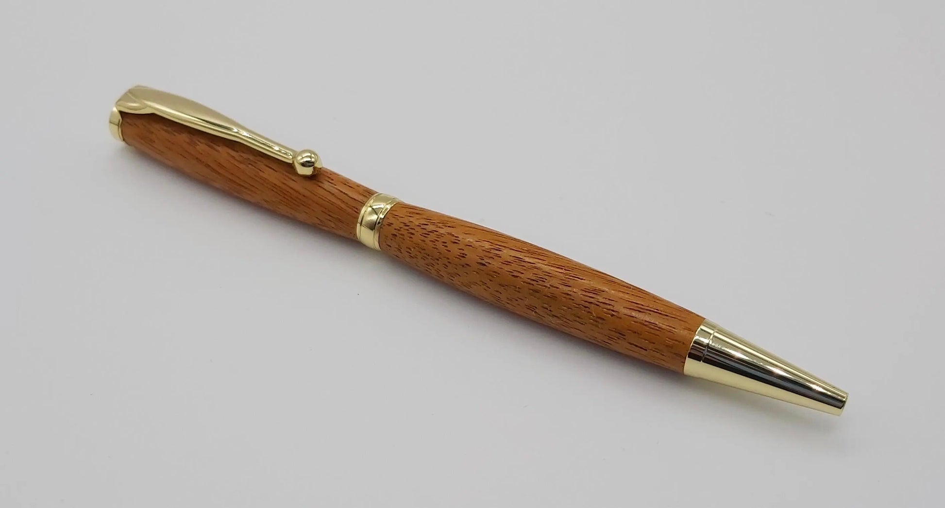 Ballpoint pen handmade in Iroko wood from Phoenix Wharf, Plymouth. DevonPens