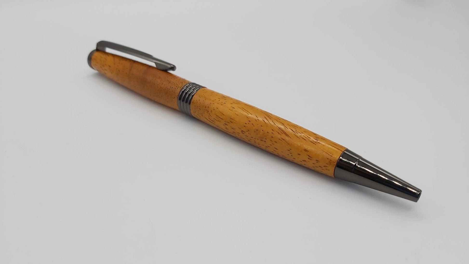 Ballpoint pen handmade in Iroko wood from Phoenix Wharf, Plymouth. DevonPens