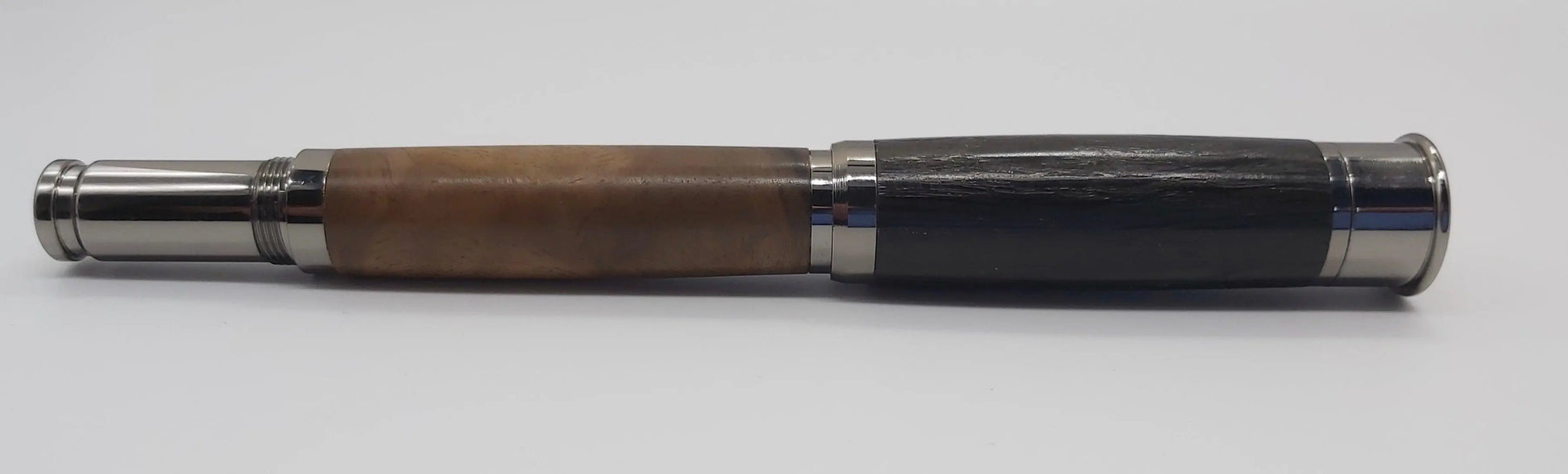 Over and under Rollerball pen with English bog oak and Turkish Walnut. DevonPens