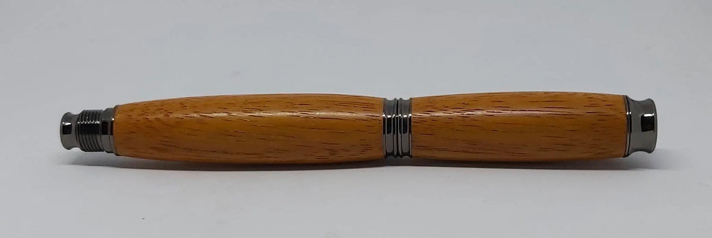 Rollerball pen handmade in Iroko wood from Phoenix Wharf, Plymouth. DevonPens