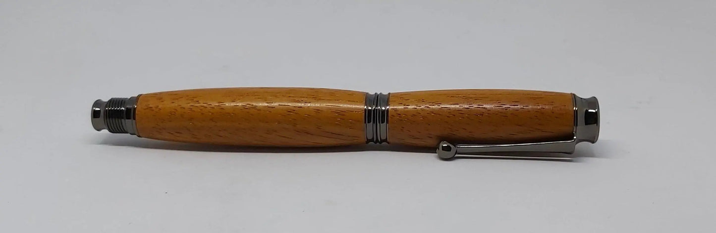 Rollerball pen handmade in Iroko wood from Phoenix Wharf, Plymouth. DevonPens